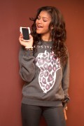 Зендая Коулман (Zendaya Coleman) 2012-10-27 posing with her new cell phone at a house in Los Angeles (14xHQ) 49ade9401276900